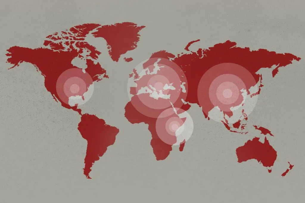 Epicenters of coronavirus pandemic on the world map background
